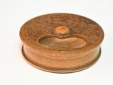 a small wooden box with a lid on a white surface