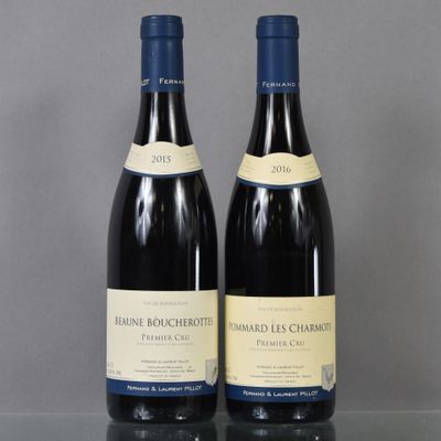 two bottles of wine sitting on top of a table next to each other