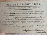 an old document with writing on it sitting on top of a table