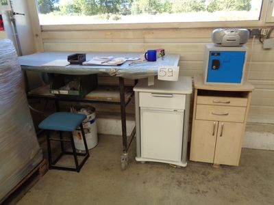 an image of a kitchen with a table and a refrigerator