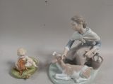 a figurine of a woman and a dog on a plate