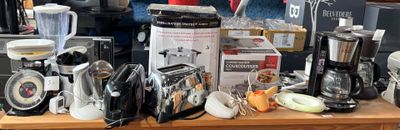 many different types of coffee makers on a table