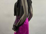 the mannequin is wearing a purple skirt and a black top