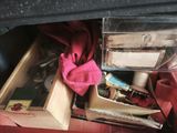 a drawer full of assorted items in a car