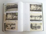 an open book with pictures of trees and buildings on it