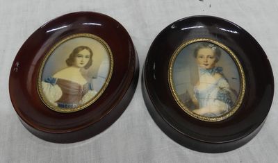 pair of miniature portraits of a woman and a child in oval frames