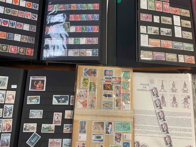 many different types of stamps on display on a table