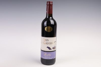 a bottle of wine that is sitting on a table