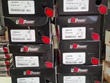 several boxes of u - power products stacked on top of each other