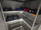 a white refrigerator with lots of shelves and bins in it