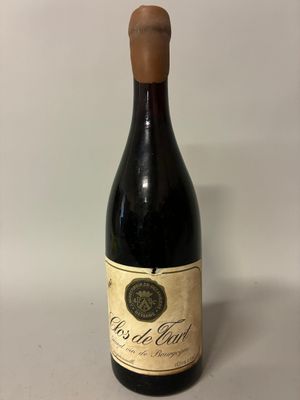 the bottle of wine is empty on the table