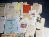 many different types of letters and envelopes laid out on a table