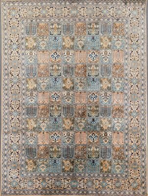 a blue and beige rug with a floral design