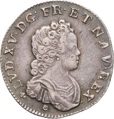 une pièce en argent avec l'image d'une femme de profil