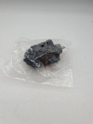 a stuffed animal in a plastic bag on a table
