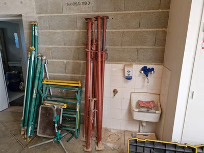 a bathroom with pipes and a toilet in it