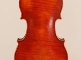 an old violin with a wooden back and a long neck