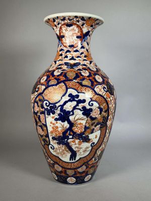 a vase with a blue and orange design on it