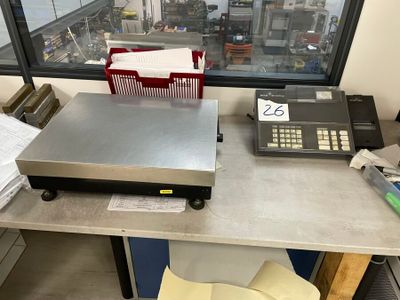a machine that is sitting on a table in front of a window