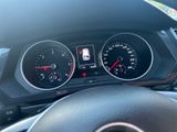 a close up of a car dashboard with a speedometer and gauges