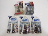 five star wars action figures sit in a row on a table