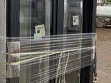 a large window that has been wrapped up on a pallet