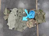 a pile of military clothing on the ground