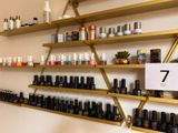 many bottles of nail polish on the shelves in the store