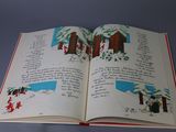 an open book with a picture of a snowman on it