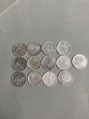a lot of coins that are on the table