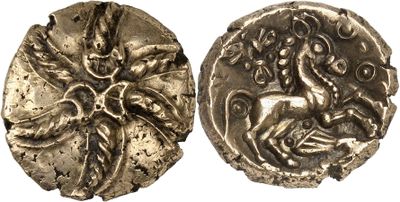 a silver coin with an image of a horse and a man on it