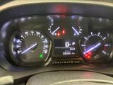a close up of a car dashboard with various gauges