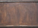 a wooden box with a metal frame on top of it