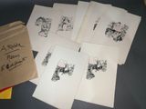a lot of drawings on a table with a bag