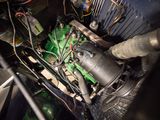 a close up of a green engine in a car