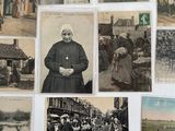 many old photos of people and animals on the wall
