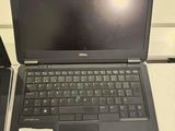 two laptops that are sitting on a table