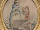 an old picture of a woman and a child in a wheelbarrow