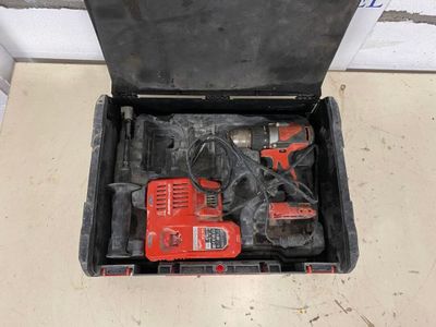 a tool box that has a drill and a hammer in it