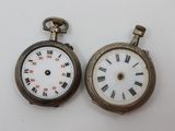 two antique pocket watches with roman numerals and roman numerals