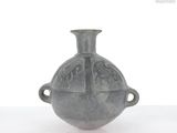 a small gray vase with handles on a white surface
