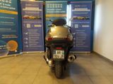 a motorcycle that is parked in front of a wall