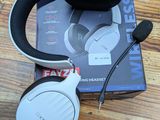 a close up of a pair of headphones sitting on top of a wooden table