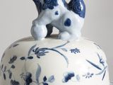 a blue and white plate with a blue and white dog on it