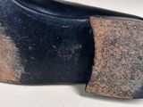a close up of a pair of shoes on a white surface