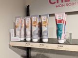 a lot of different types of hand creams on a shelf