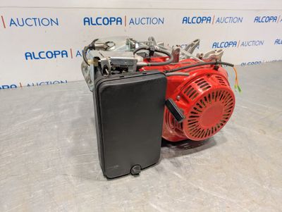 a close up of a small red engine on a table