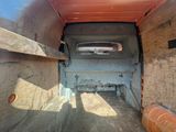 a view of the back end of a truck with the door open