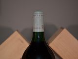 a bottle of wine that is sitting on a table