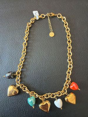 a gold chain bracelet with heart charms and charms on it